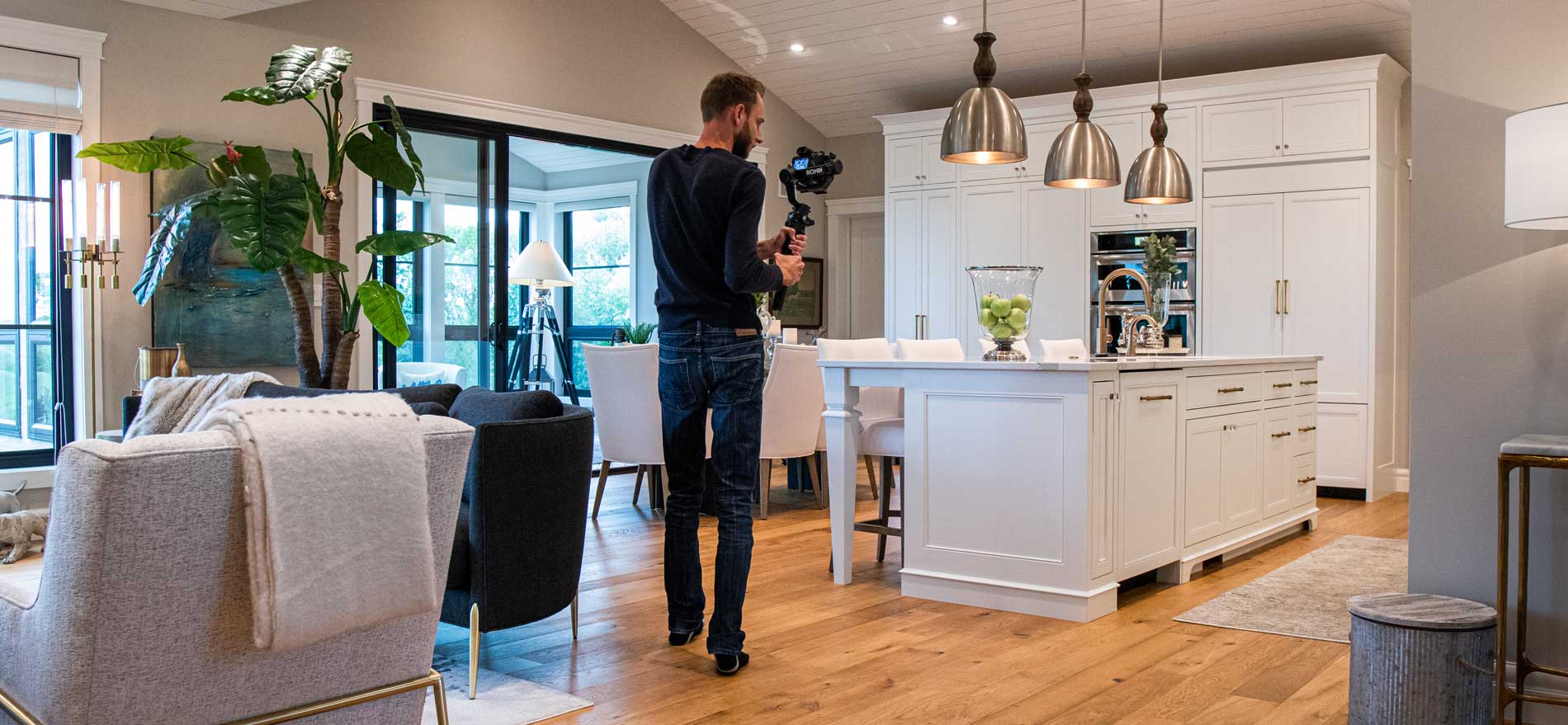 Man photographing house interior